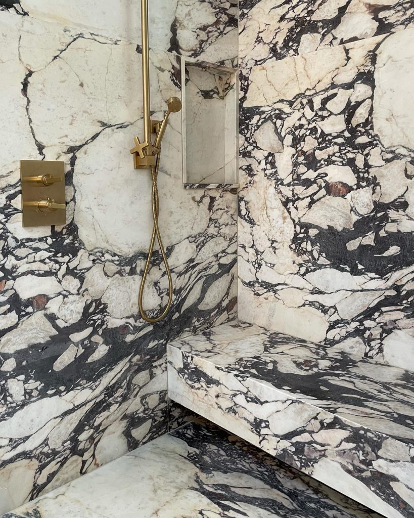 Marble shower room with brass hardware