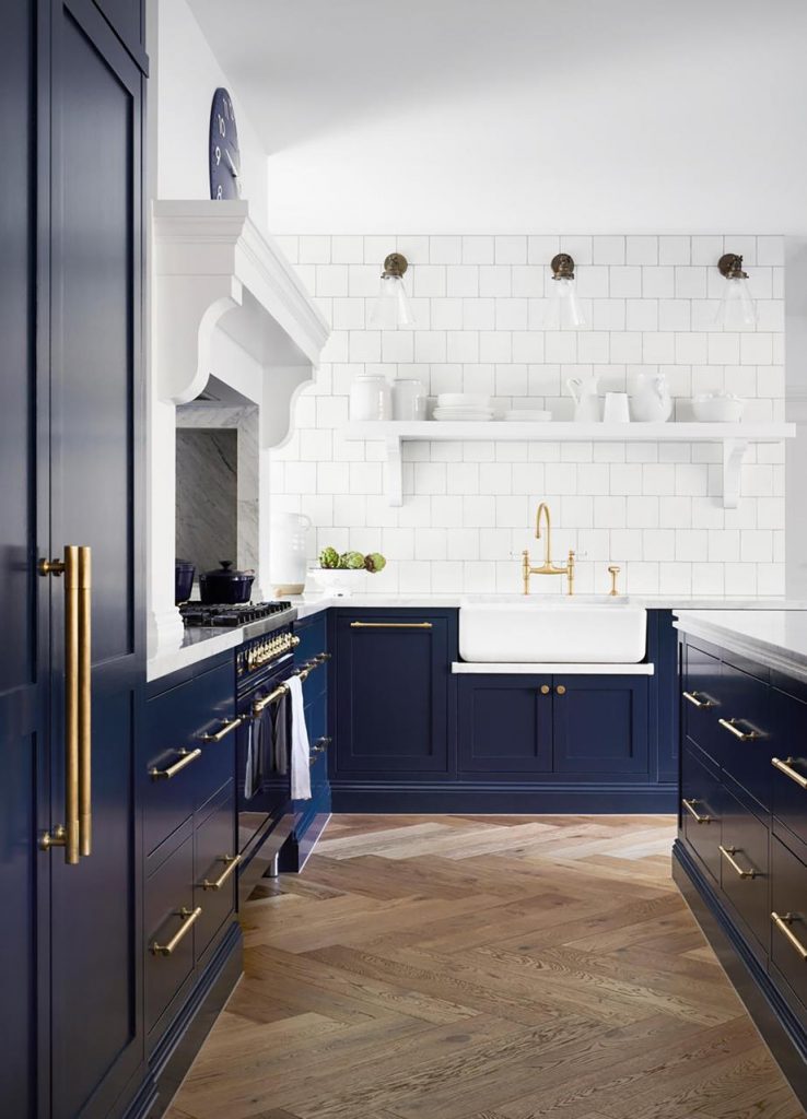 blue painted kitchen cabinets brass hardware timber herringbone flooring