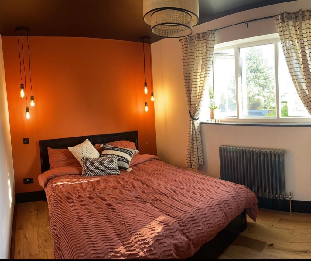 Orange Two Colour Combination for Bedroom Walls with black ceiling