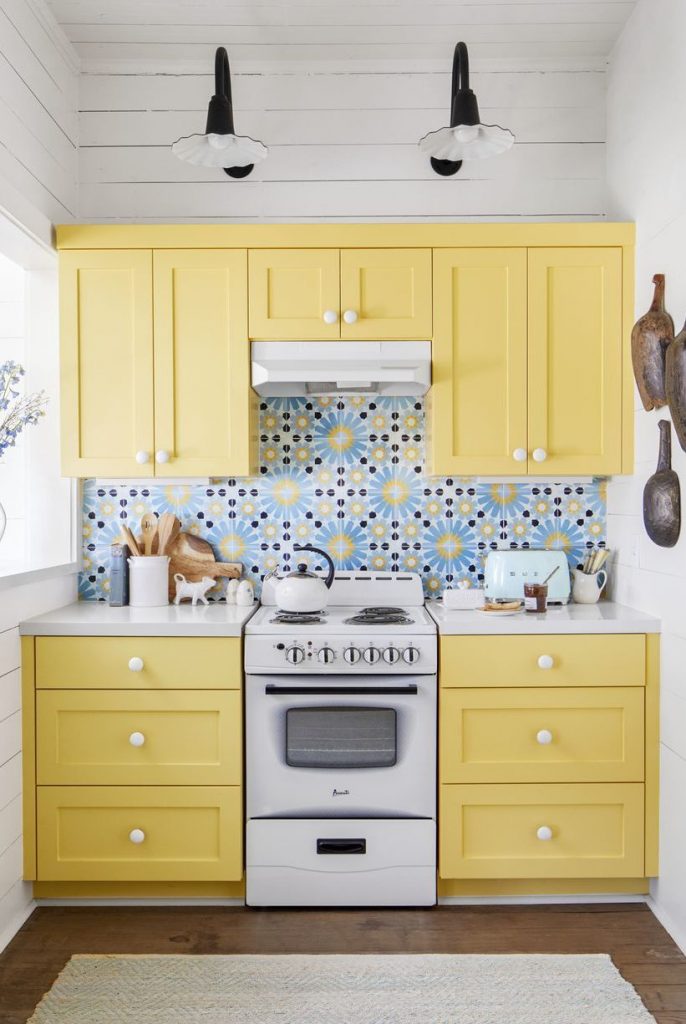 Sherwin Williams Honey Bees painted yellow kitchen cabinets