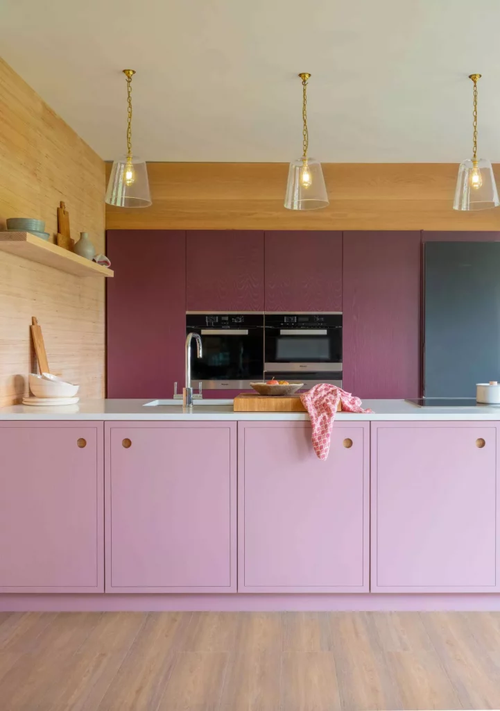 Two toned pink paint color kitchen cabinets