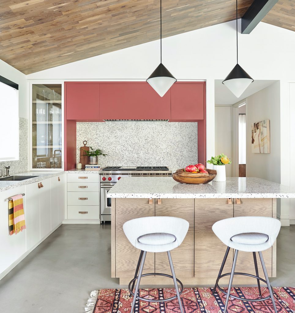 modern kitchen with pink upper cabinets