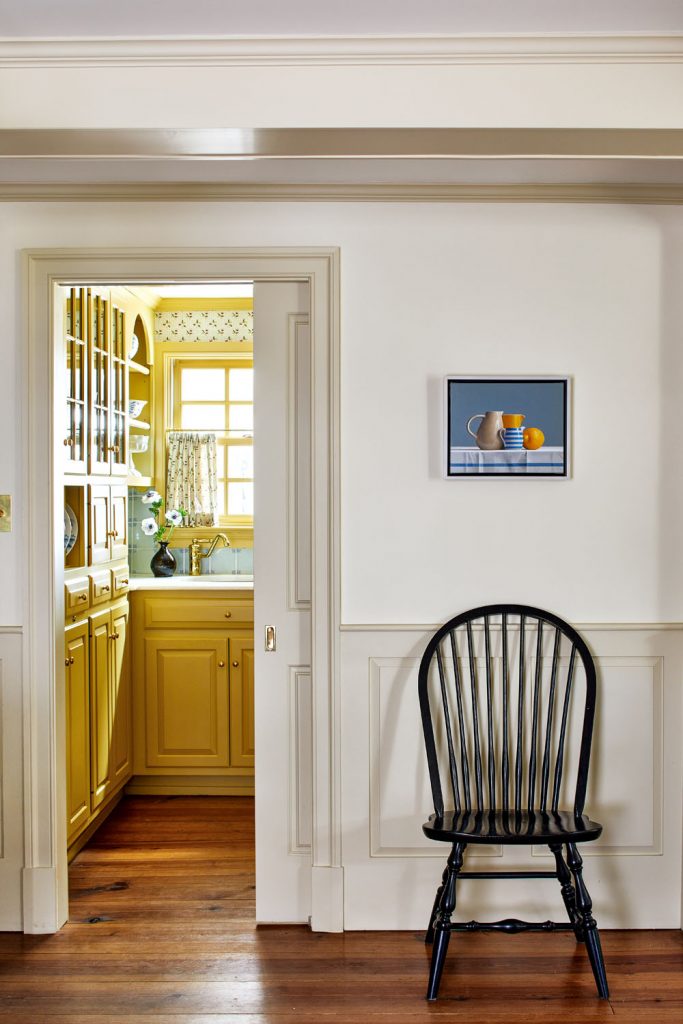 neutral walls leading to the yellow butler's pantry