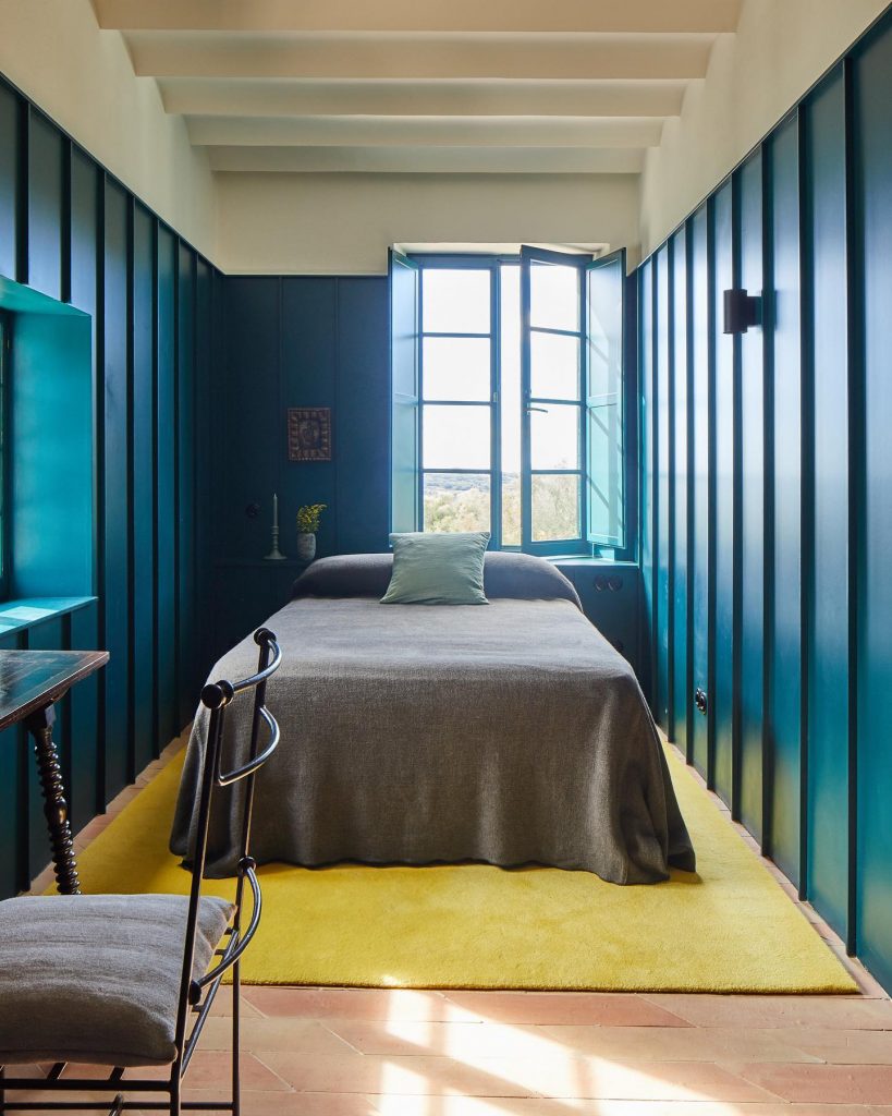 bedroom with walls painted in a bold blue