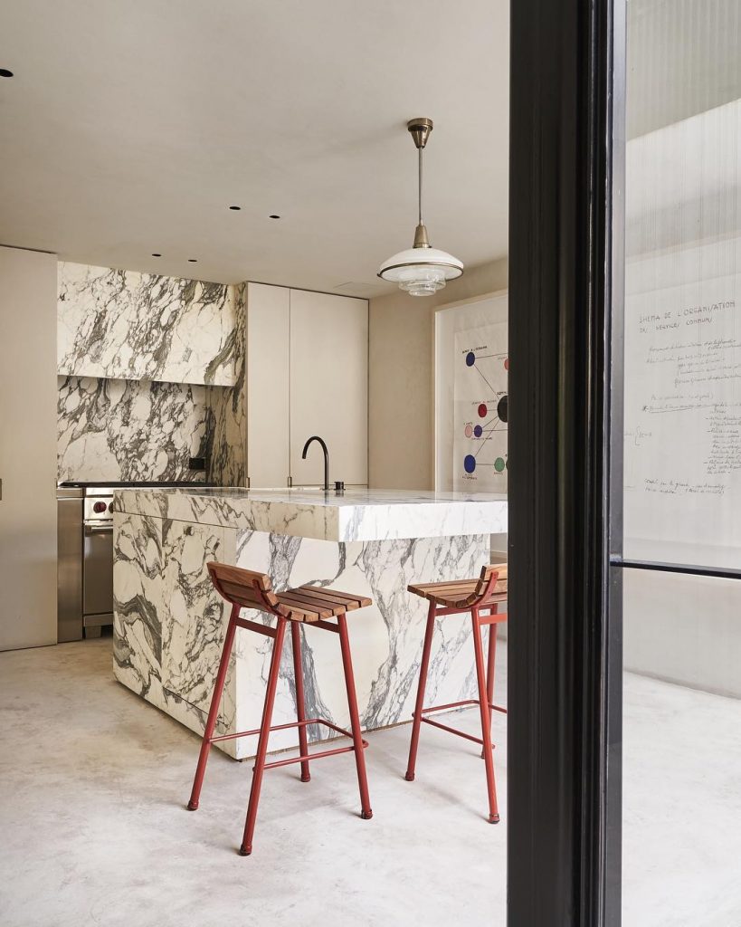 contemporary kitchen with marble backsplash and kitchen island