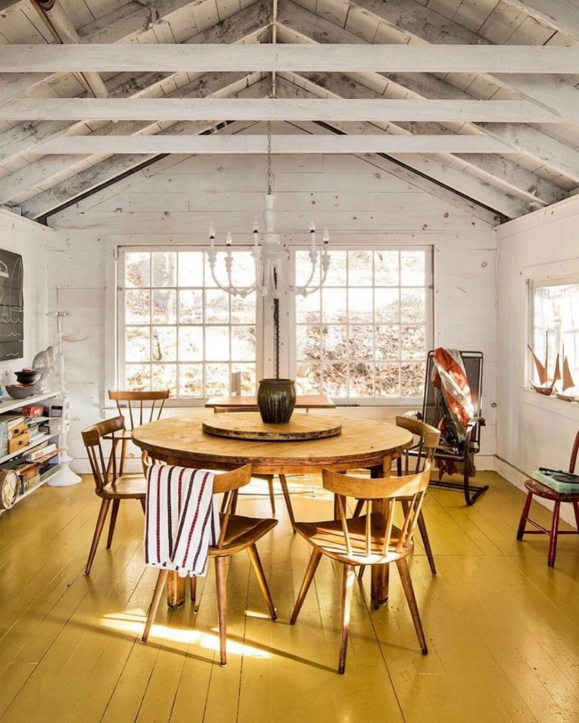 Rustic dining painted yellow floors