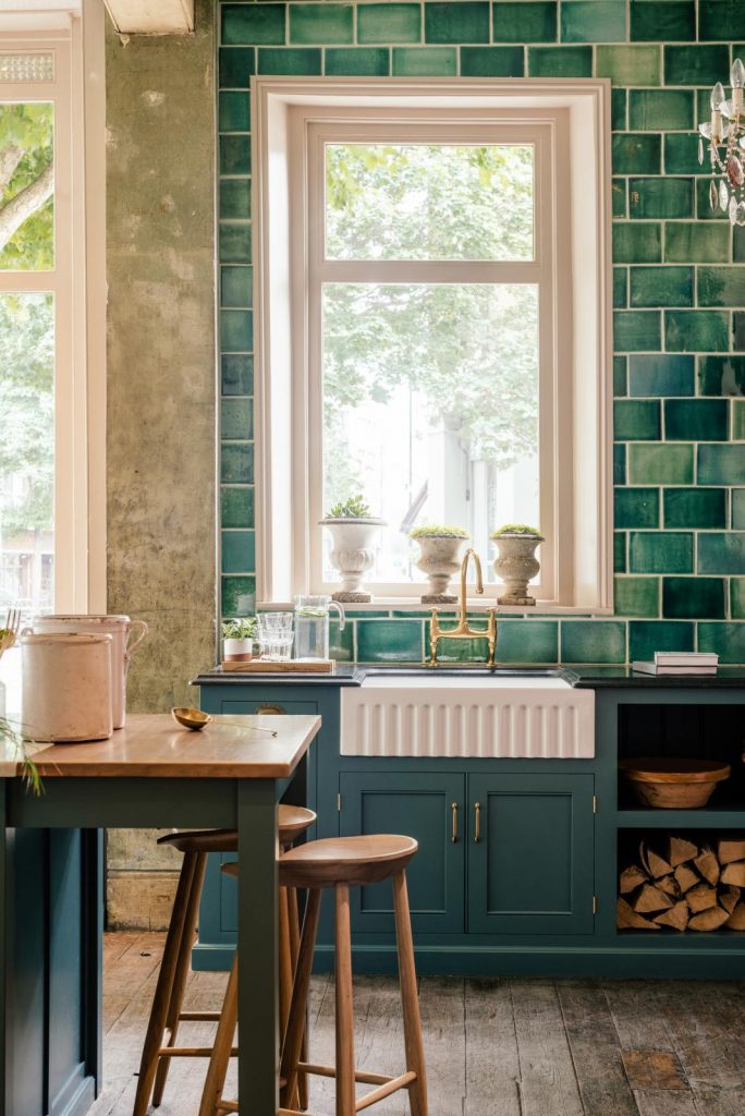 kitchen with green subway tiles
