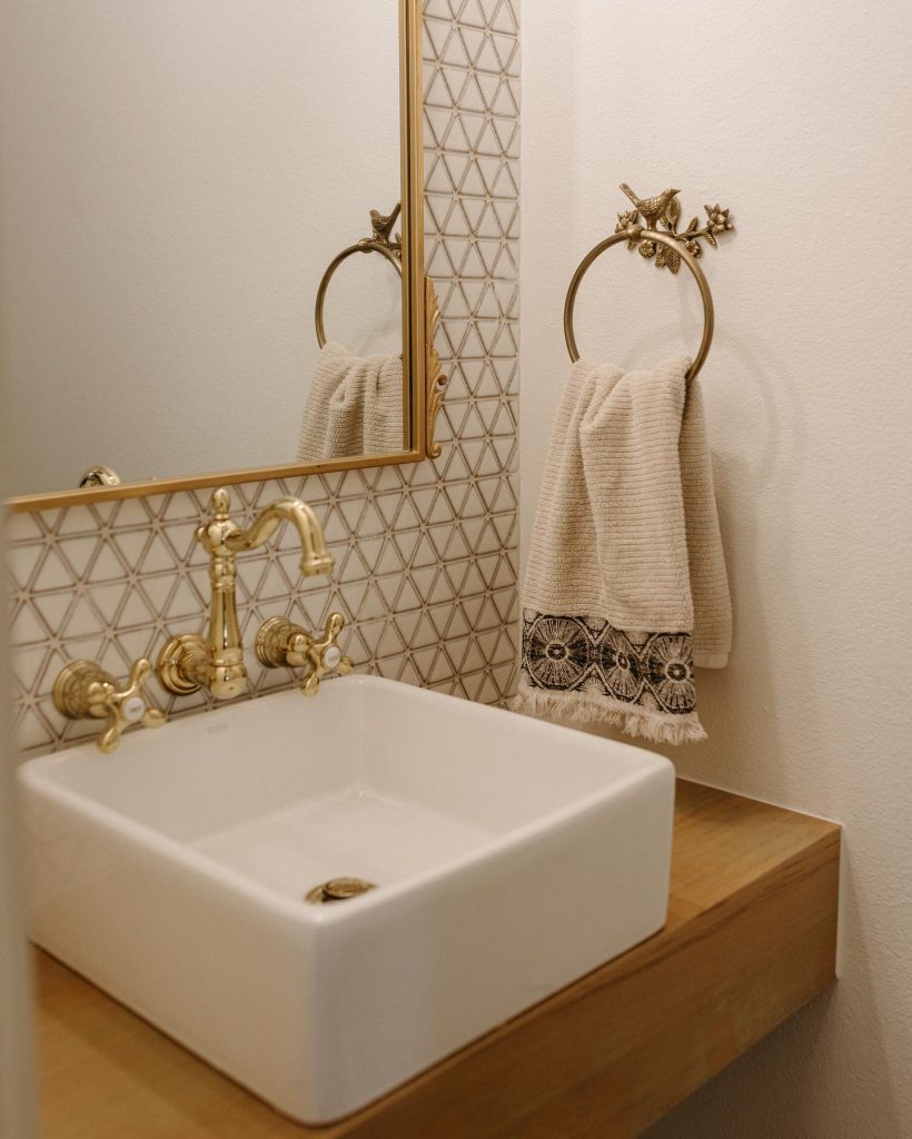 gold and white bathroom vanity sink