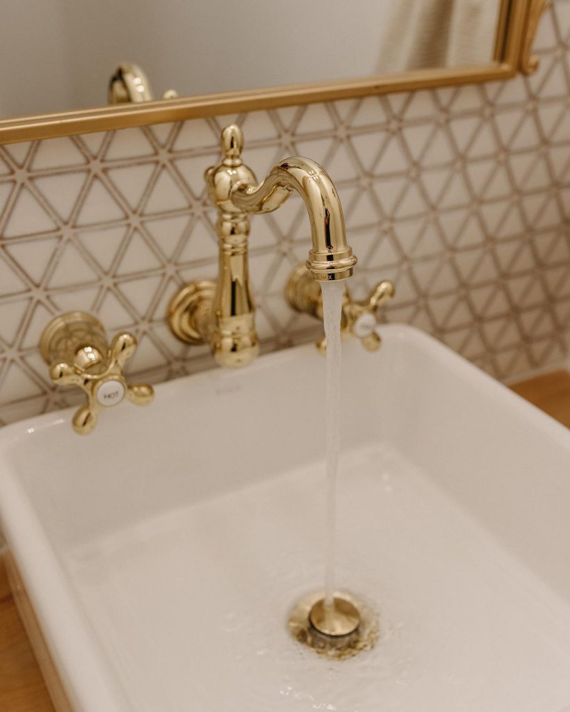 white and gold bathroom