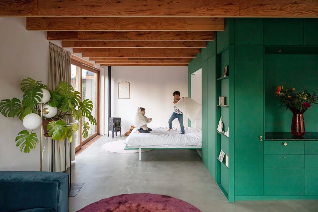 A Murphy bed concealed in a first-floor wall provides an extra sleeping space.