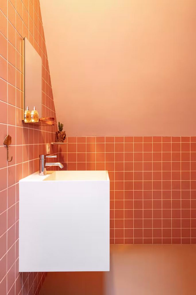 Minimal modern bathroom in salmon pink