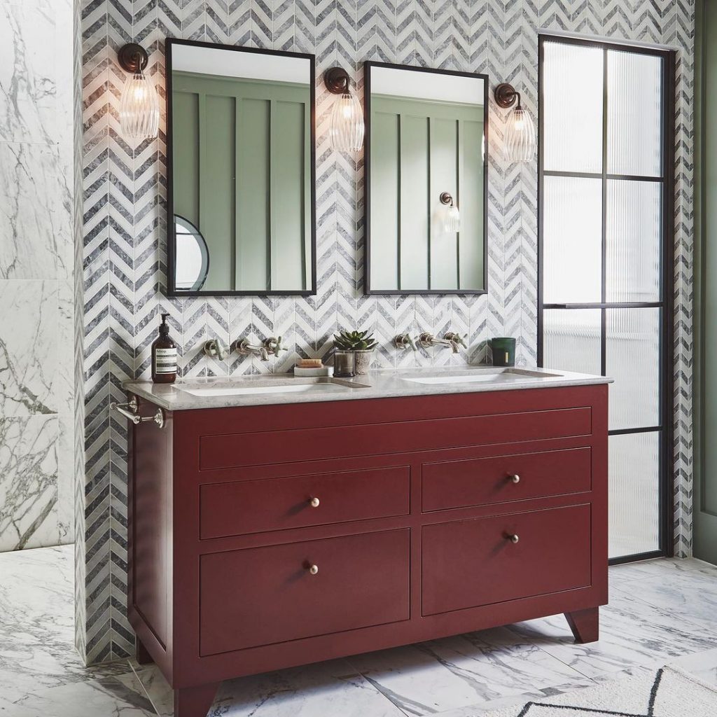 Modern marble bathroom with red vanity