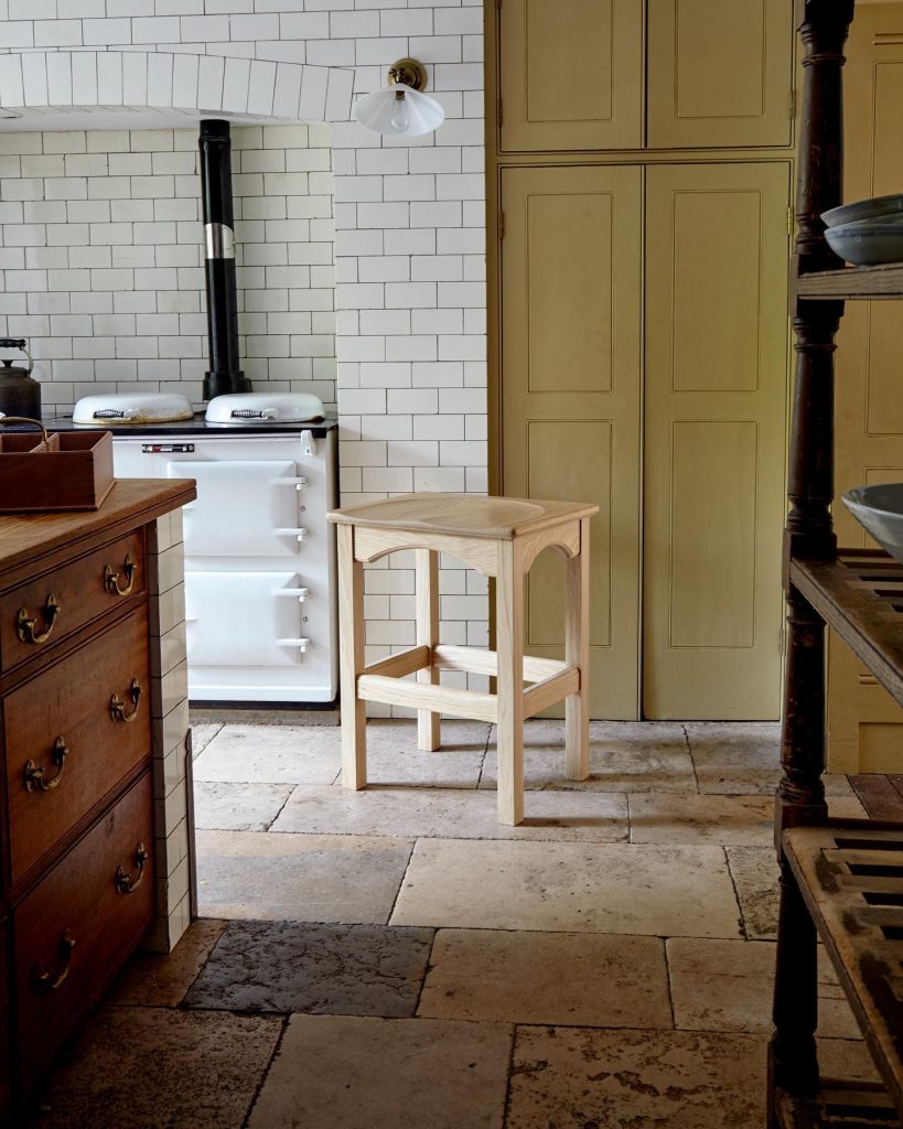 antique English kitchen with yellow cupboards