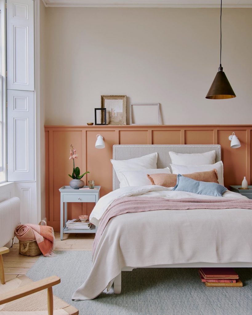 bedroom with orange wainscotting