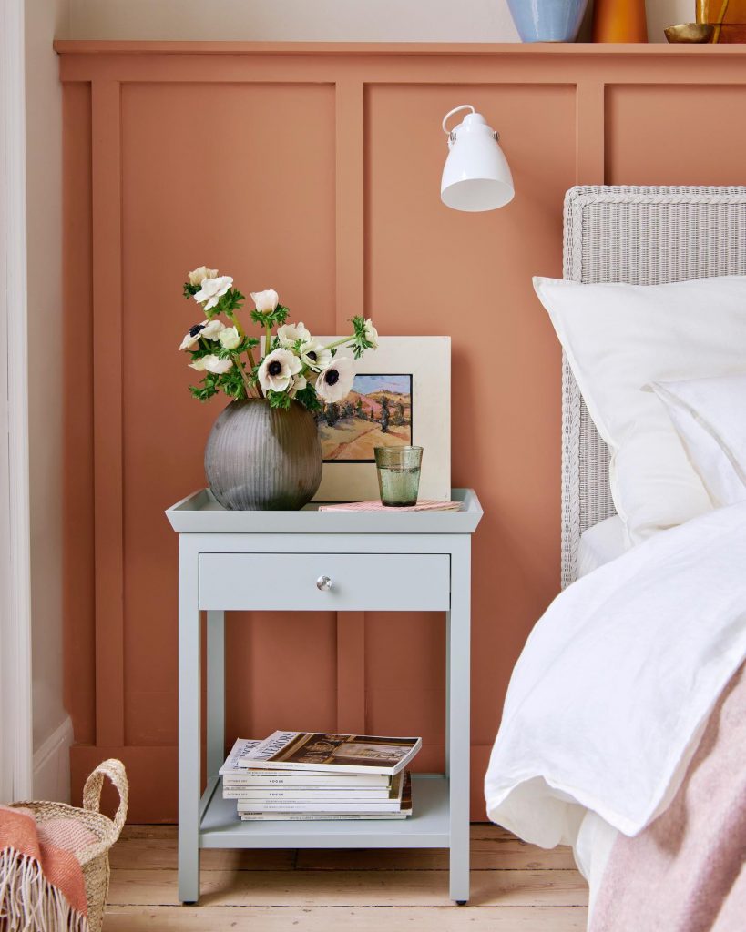 bedroom with orange wainscotting