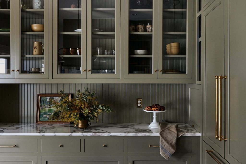 sage green kitchen with marble counters