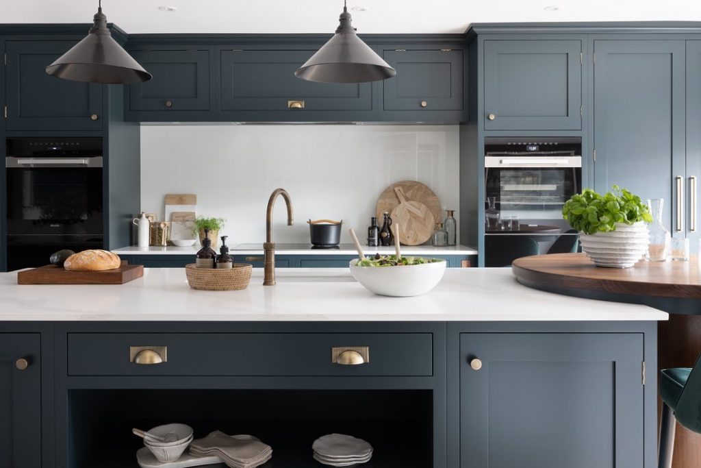 Benjamin Moore Regent Green kitchen cabinets with brass hardware